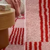 Alfombra interior con motivo damero rojo y rosa