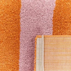 Alfombra interior con rayas naranja y rosa