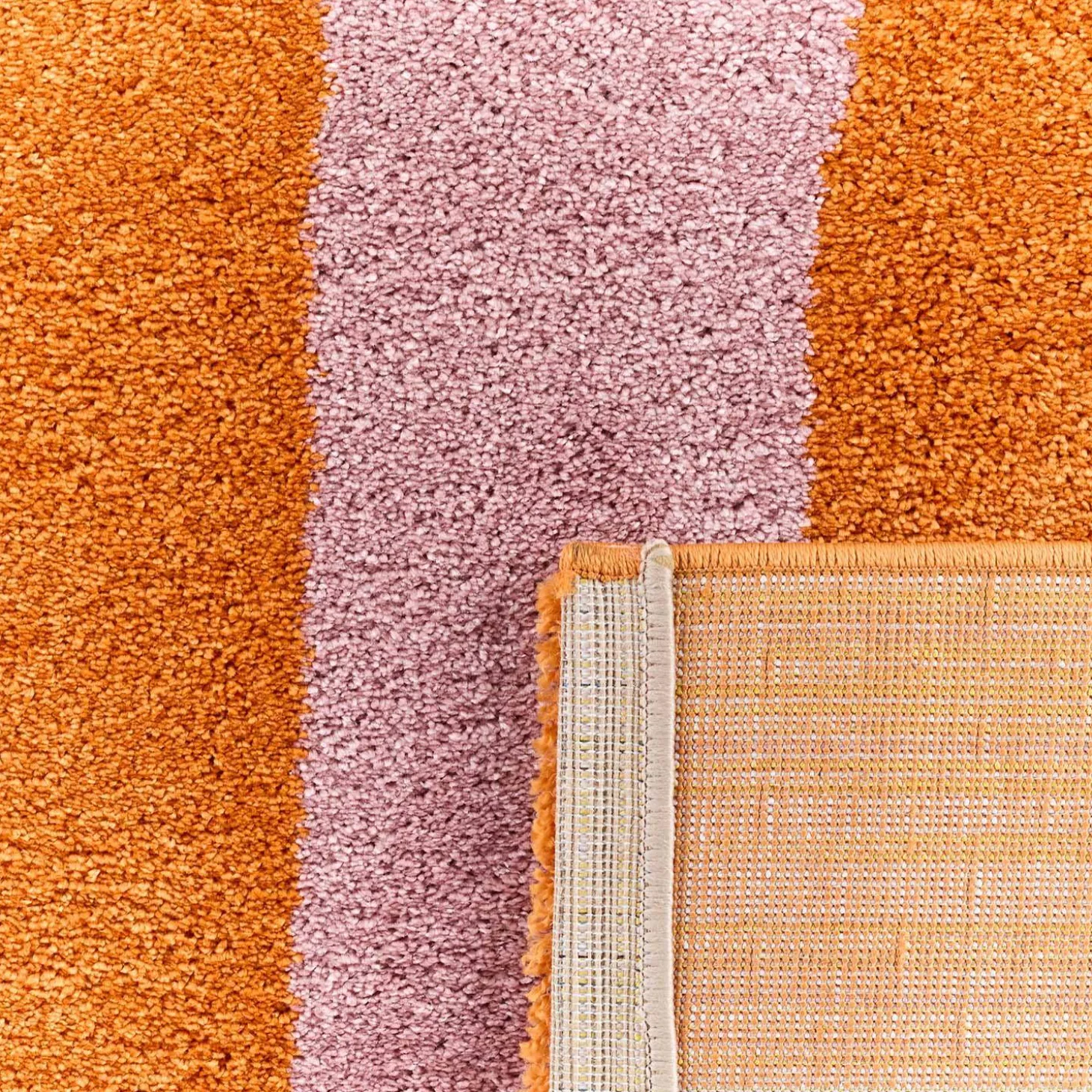 Alfombra interior con rayas naranja y rosa