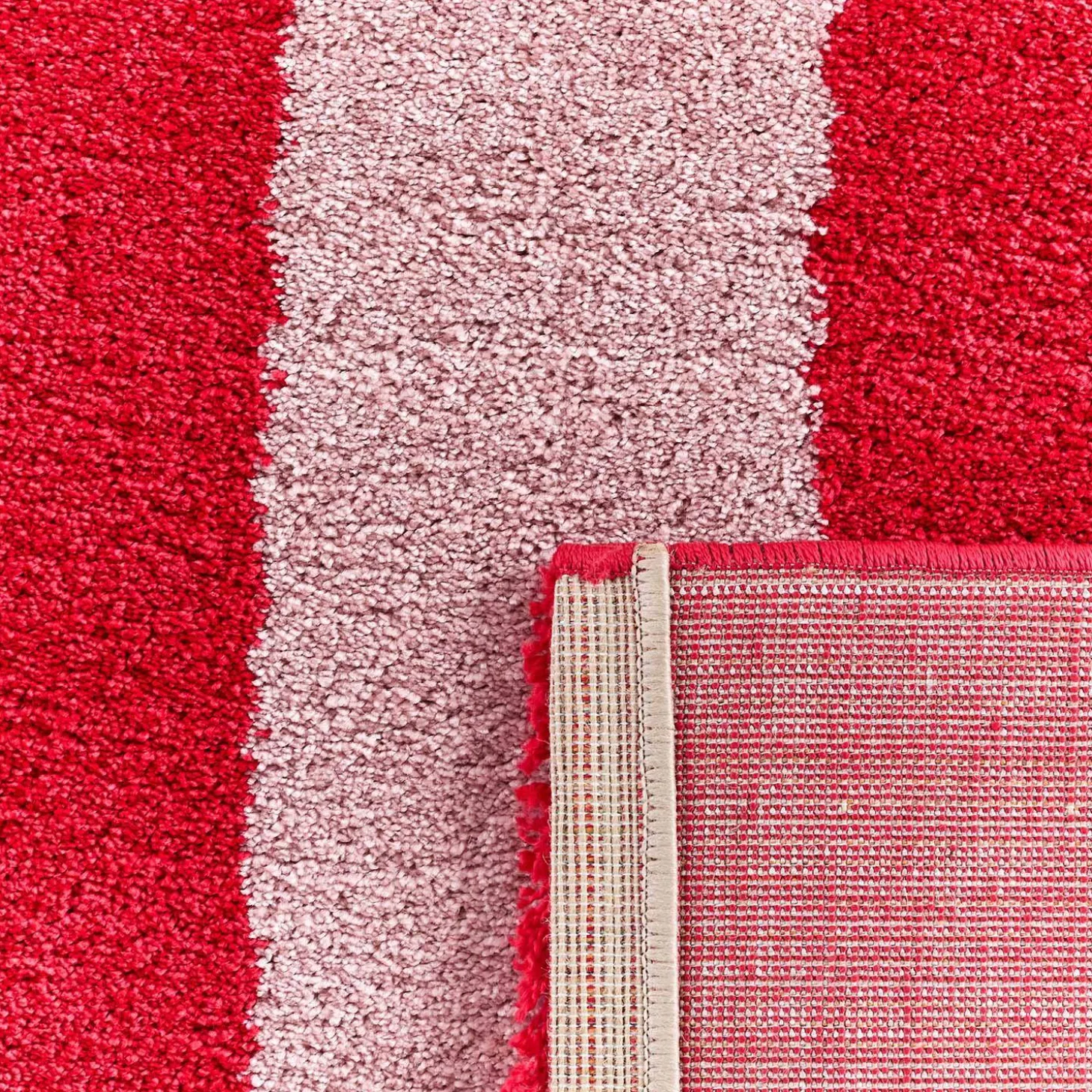 Alfombra interior con rayas rojas y rosas