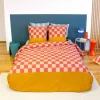 Juego de cama de algodón con estampado de damero, 2 plazas rojo y naranja