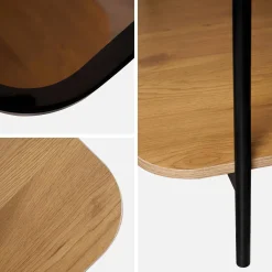 Mesa de centro vintage de metal negro con tapa de cristal y decoración de madera
