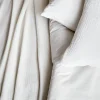 Ropa de cama de gasa y algodón blanco