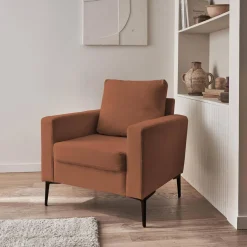 Sillón de pana y patas de metal