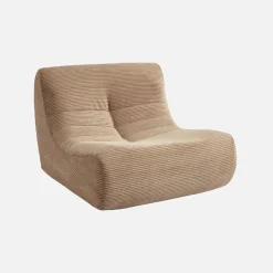 Sillón de terciopelo de pana fina con reposapiés