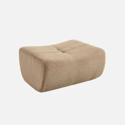 Sillón de terciopelo de pana fina con reposapiés