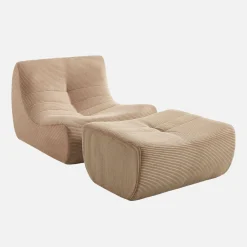 Sillón de terciopelo de pana fina con reposapiés