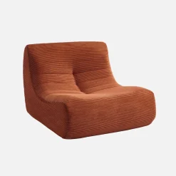 Sillón de terciopelo de pana fina con reposapiés