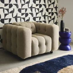 Sillón tapizado en tejido borreguito