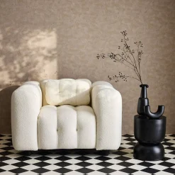 Sillón tapizado en tejido borreguito